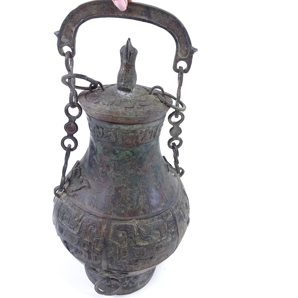 A large Chinese verdigris bronze flagon and cover, with relief moulded decoration and text, bird - Image 3 of 6