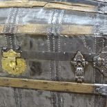 A large Victorian polished metal and wood-bound dome-top travelling trunk with brass lock, length