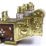 A Moroccan street vendor shoe shine kit, brass-mounted wood case, with brass-lidded bottles,