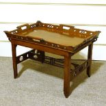 A Victorian mahogany tray-top occasional table, with carved and pierced gallery, and pierced
