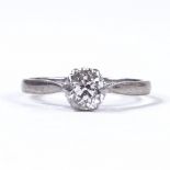 An early 20th century 18ct white gold 0.9ct solitaire diamond ring, platinum topped settings,