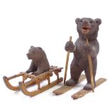 2 small Black Forest carved wood skiing bears, largest height 8cm
