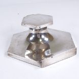 A large George VI hexagonal silver inkwell, glass liner with front lip pen tray and wood base, by