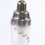 A 1950s patent electroplate cocktail shaker, with rotating outer case to show cocktail