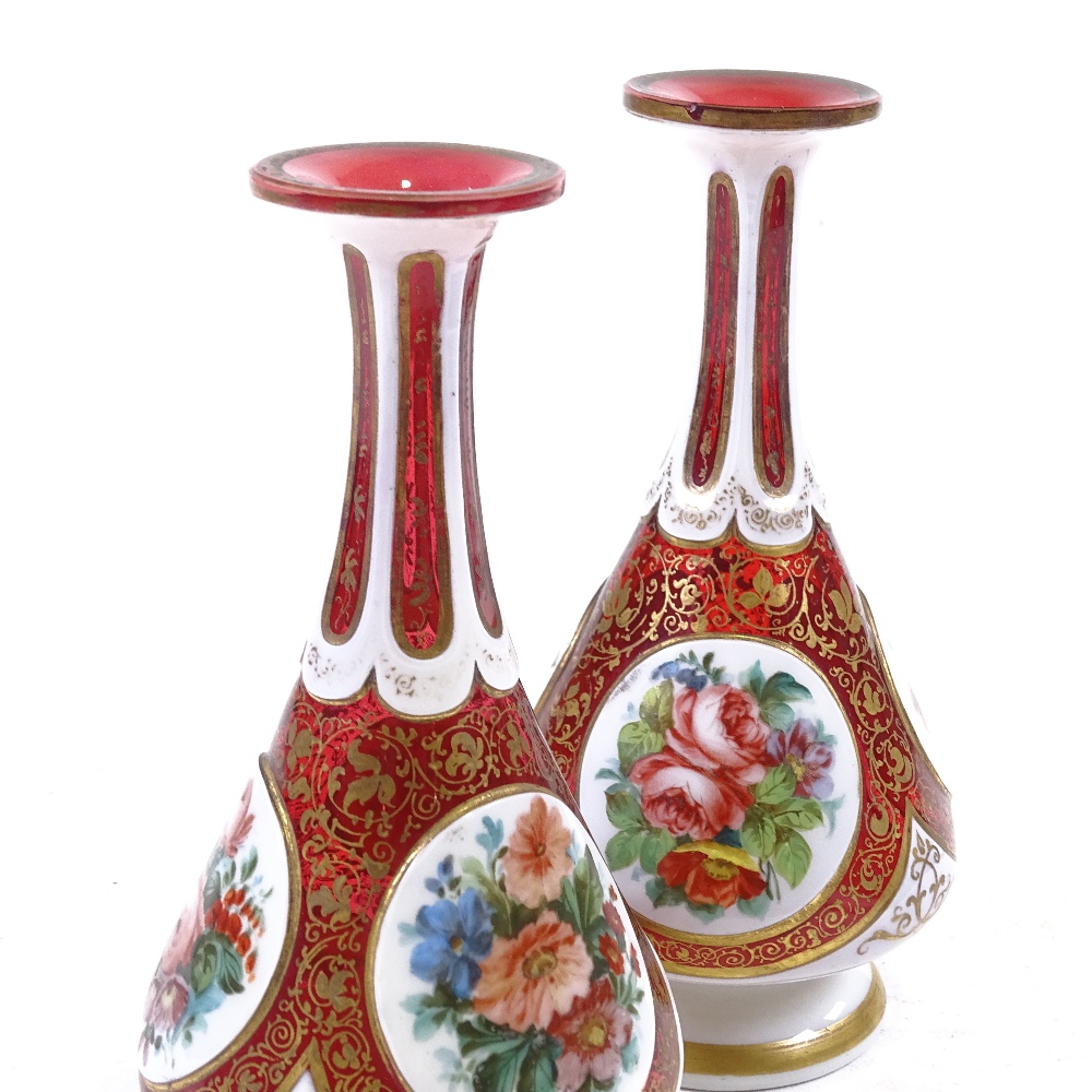 A pair of Bohemian ruby and milk overlay glass narrow-necked vases, with hand painted floral - Image 3 of 3