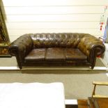 A brown buttoned leather-upholstered 3-seater Club Chesterfield sofa, early 20th century, overall
