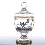 A good quality Moser glass jar and cover, with painted silhouette designs of children at play, and