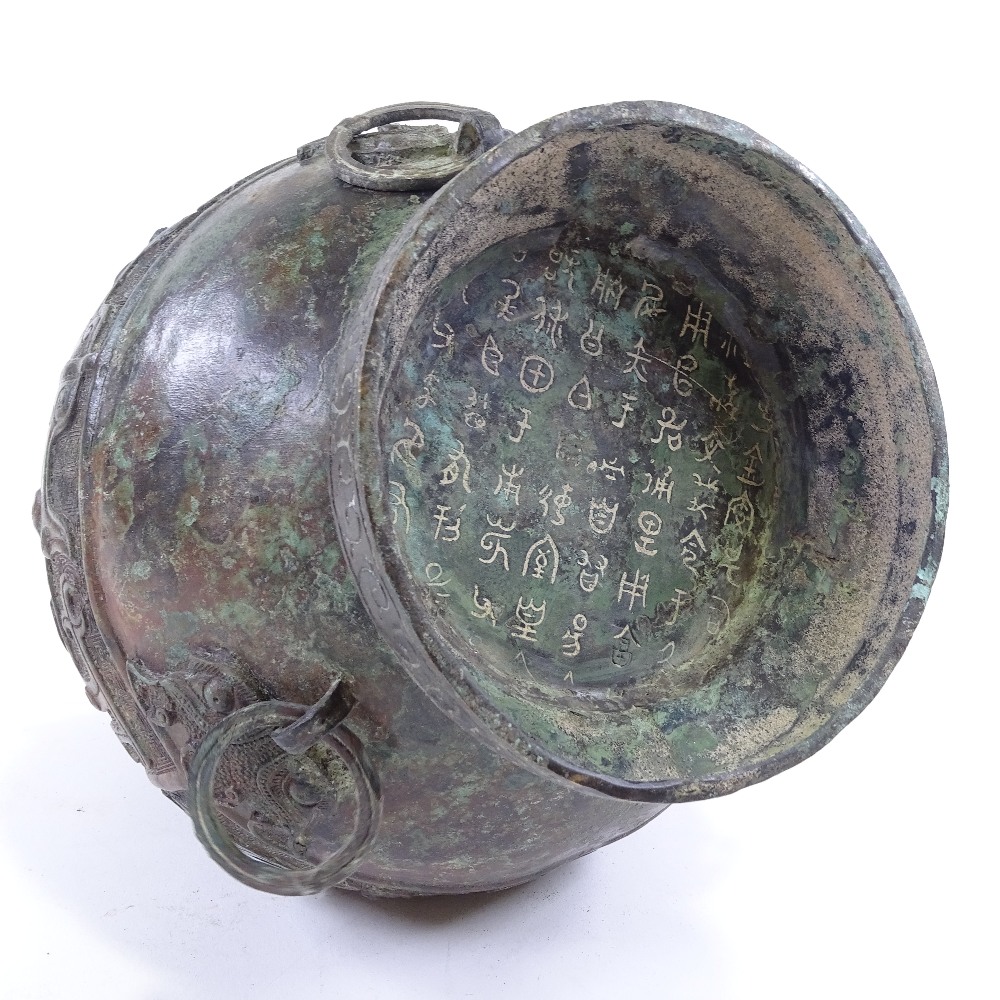 A large Chinese verdigris bronze flagon and cover, with relief moulded decoration and text, bird - Image 5 of 6