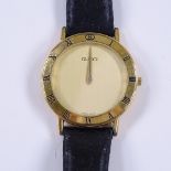 GUCCI - a gold plated 3000.2.M quartz wristwatch, brushed gilt dial with Roman numeral bezel, serial