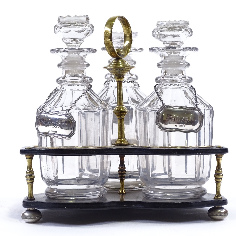 A 19th century brass-mounted ebonised wood 3 bottle decanter stand with brass carrying handle, - Image 2 of 3