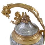 An ornate Rococo style turned marble and gilt-bronze mounted urn and cover, with cherub finial,