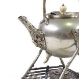 An Arts and Crafts naturalistic electroplate tea kettle with stand and burner