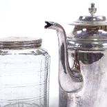 An early 19th century French white metal coffee pot with side pouring handle, height 18cm, and a