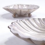 A pair of Edwardian silver shell-shaped butter dishes, with frosted glass liners, by Atkin Brothers,