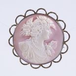 A Victorian relief carved pink cameo shell brooch, depicting Classical lady, in unmarked gilt-
