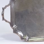 A large late Victorian silver 2-handled tea tray, rectangular scalloped form, by Charles Stuart