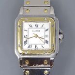CARTIER - a bi-metal Santos automatic wristwatch, white dial with painted Roman numeral hour
