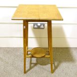 An Arts and Crafts oak 2-tier plant stand, by C F A Voysey, 38cm across, reference Good Citizens