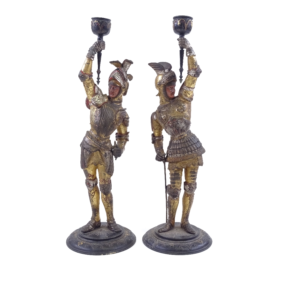 A pair of Victorian painted and gilded spelter candle holders, supported by knights in armour, - Image 2 of 3