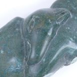 A Zimbabwean carved green soapstone Shona bird sculpture, indistinctly signed J Takk?, length 40cm