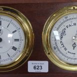 A modern ship's style quartz clock/barometer on mahogany plaque, length 30cm