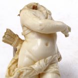 A 19th century carved ivory Cupid figure, on green onyx base, figure height 12cm (A/F)