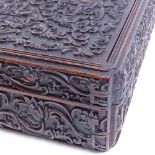 A Chinese carved wood box with allover foliate and floral scrolled decoration, length 36cm