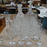 A cut-glass decanter and stopper, a pair of smaller decanters, matching tumblers and Sherry glasses