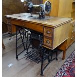 A Vintage walnut-cased Frister & Rossmann sewing machine and treadle sewing machine, W93cm