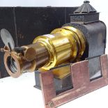 A Victorian tinplate and brass-mounted Magic Lantern, registered no. 519324, L47cm, original metal