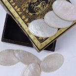 A set of carved mother-of-pearl gaming counters, and a lacquered and gilded Oriental box