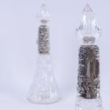 A pair of glass scent bottles, with embossed silver collars