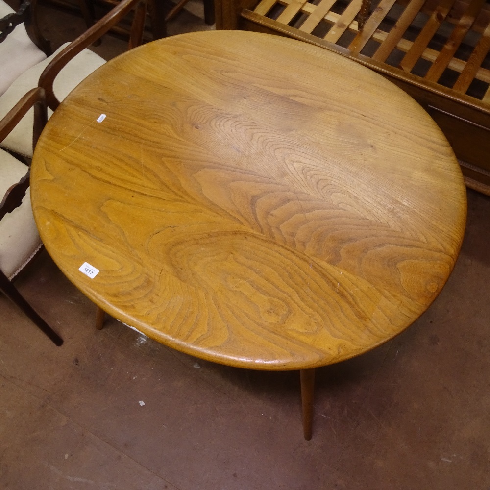 An Ercol elm and beech oval kitchen table on turned legs, W100cm, H73cm - Image 3 of 3