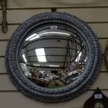 A silver painted circular convex wall mirror, overall diameter 53cm