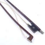 A nickel-mounted violin bow, stamped W Dollenz Leipzig, and another unnamed nickel-mounted bow,