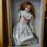 A 19th century wax-headed doll with cloth body and limbs, height 43cm, in pine display box