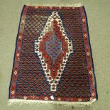 A Kilim red and blue ground floral pattern rug