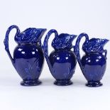 Victorian Aesthetic Movement graduated set of 3 pottery ewers, in the form of swans and bulrushes,