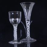 An 18th century cordial glass with funnel-shaped bowl and milk twist stem, height 18.5cm, and a
