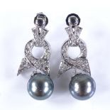 A pair of Art Deco style 14ct white gold cultured Tahitian pearl and diamond bow earrings, with