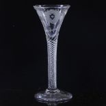 An 18th century cordial glass, with rose design wheel-cut funnel-shaped bowl and multi-twist stem,
