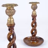 A pair of oak open twist candlesticks with brass fittings, height 22cm