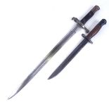 A First War Period sword bayonet with metal scabbard, and another bayonet and scabbard (2)