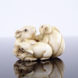 A 19th century Japanese ivory netsuke, depicting 3 rats, 4cm across