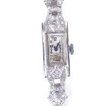 A lady's Art Deco platinum and diamond set mechanical cocktail wristwatch, silvered dial with