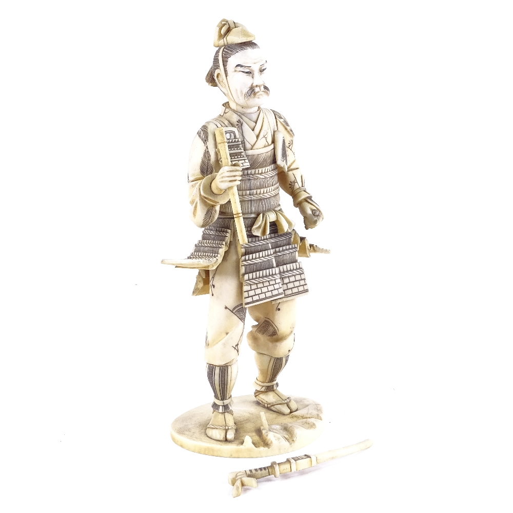 A Japanese ivory carving of a Samurai Warrior, Meiji Period, signed with lacquer seal under base, - Image 2 of 4