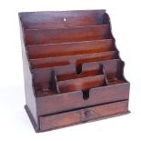 A Victorian mahogany desk-top stationery rack, with drawer below, width 28cm