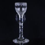 An 18th century cordial glass, with wheel-cut bowl and panel-cut stem, height 16cm Perfect condition