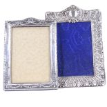 2 Victorian and Edwardian silver-fronted photo frames, relief embossed floral decoration, largest