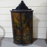 A 19th century bow-front 2-door hanging corner cupboard, with painted religious scene, height to top